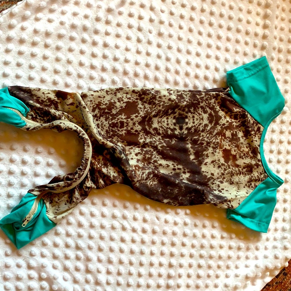 Turquoise and cowhide jumper